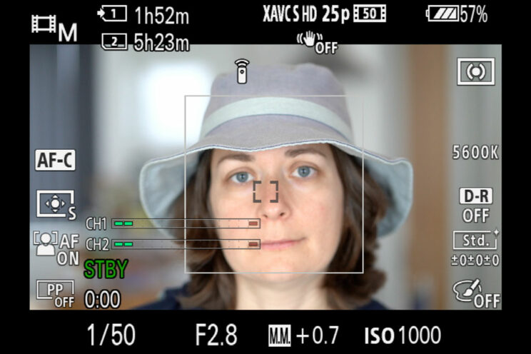 screenshot of the A7 III live view showing face detection focusing on the brim of the hat rather than the person's face