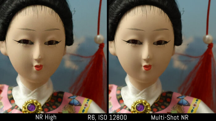 crop of the japanese doll out of camera JPEG image to show the difference in noise at 12800 ISO with noise reduction set to High and Multi-Shot NR for the Canon 