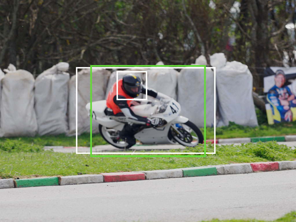 Motorbike racer taking a corner, with bright and green frames showing bird detection and the Target setting