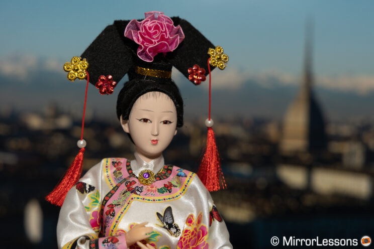 Japanese doll with city background for the ISO test.