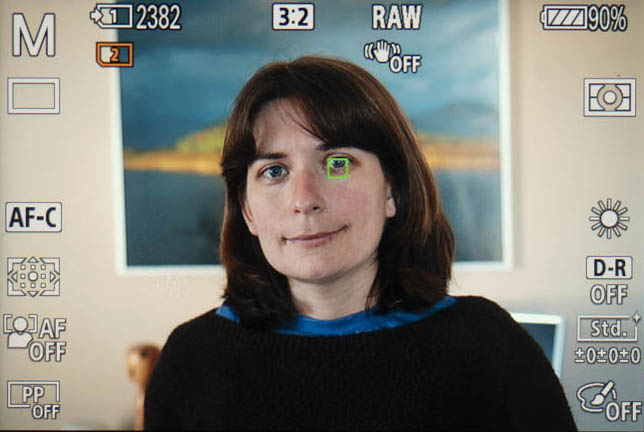 screenshot from the live view of the Sony A7 III showing eye detection at work with the head-shot portrait of a woman